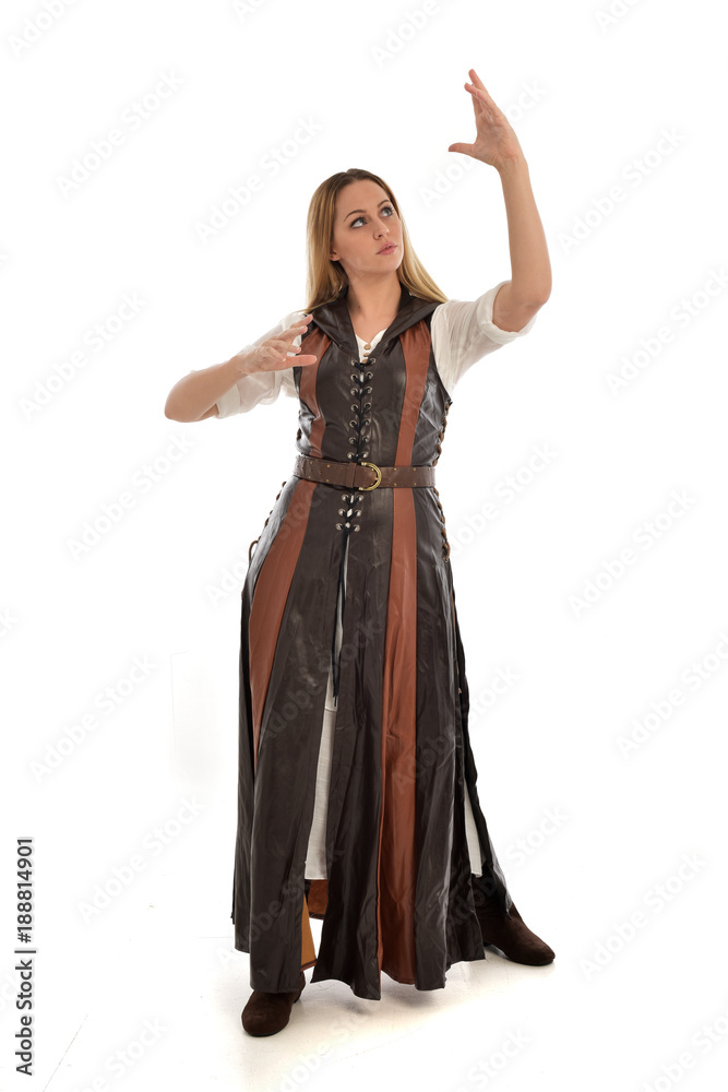 full length portrait of girl wearing brown fantasy costume. standing pose on white studio background. full length portrait of girl wearing brown fantasy costume. standing pose on white studio background.