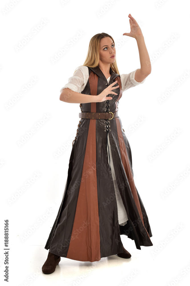 full length portrait of girl wearing brown  fantasy costume. standing pose on white studio background. 