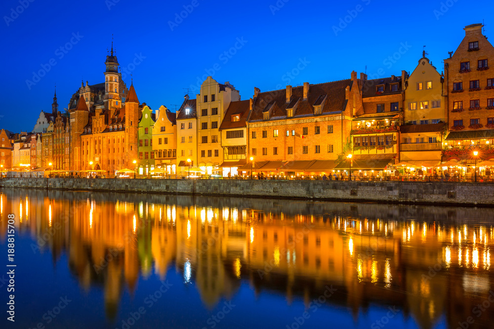 Gdansk at night reflected in Motlawa river, Poland