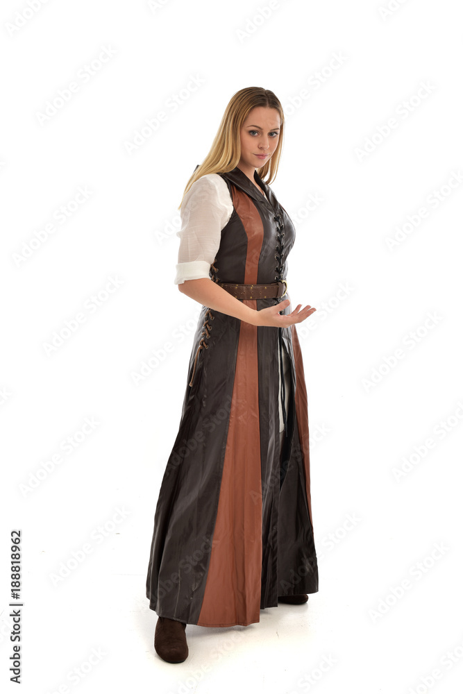 full length portrait of girl wearing brown  fantasy costume. standing pose on white studio background. 