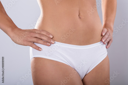 Woman body in white cotton underwear