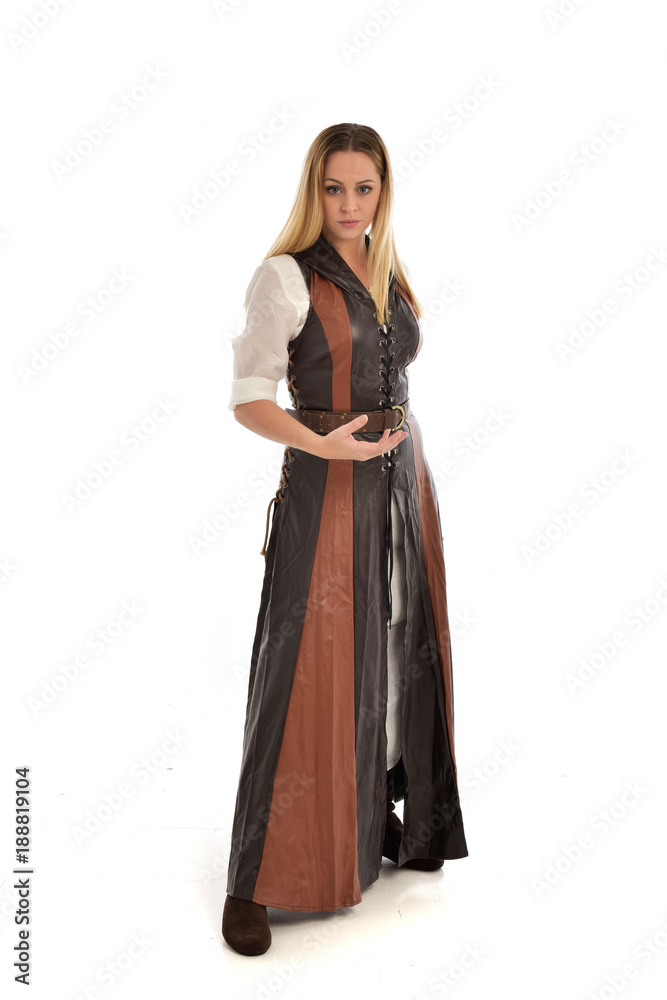 full length portrait of girl wearing brown fantasy costume. standing pose on white studio background. full length portrait of girl wearing brown fantasy costume. standing pose on white studio background.