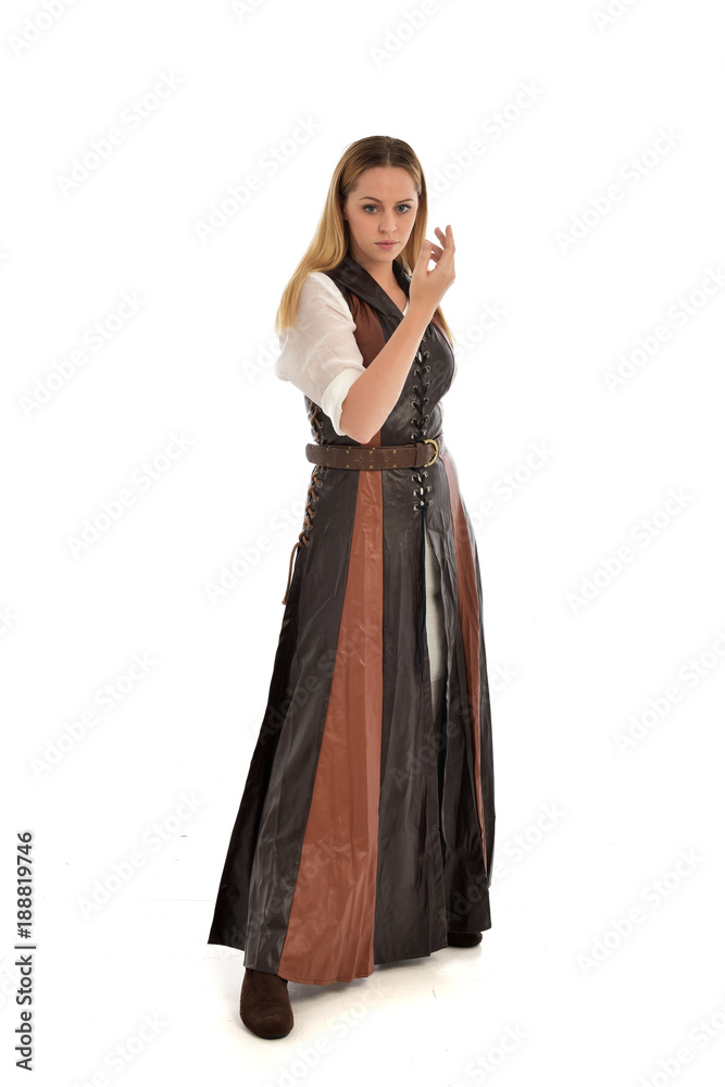 full length portrait of girl wearing brown  fantasy costume. standing pose on white studio background. 