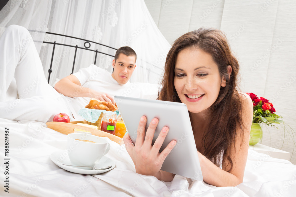 Couple Having Breakfast In Bed