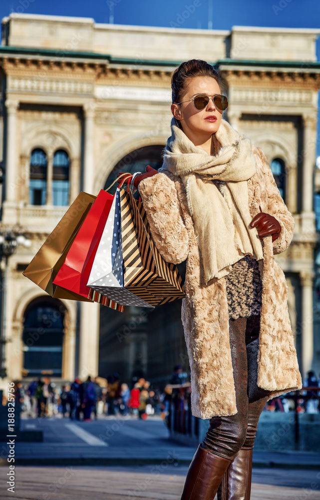 modern tourist woman in Milan, Italy looking into distance