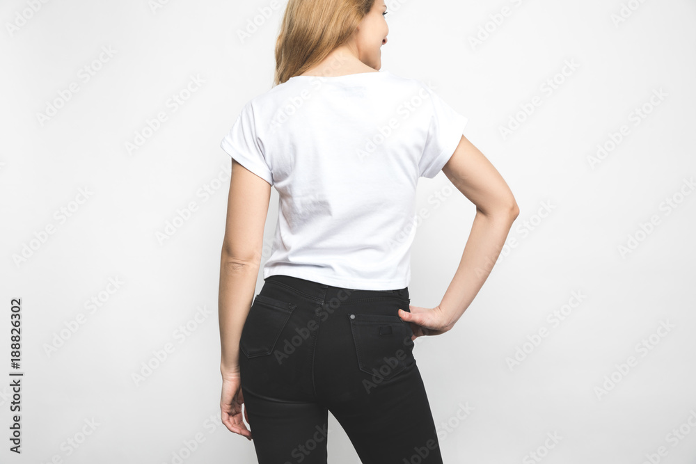 back view of young woman in blank t-shirt on white back view of young woman in blank t-shirt on white
