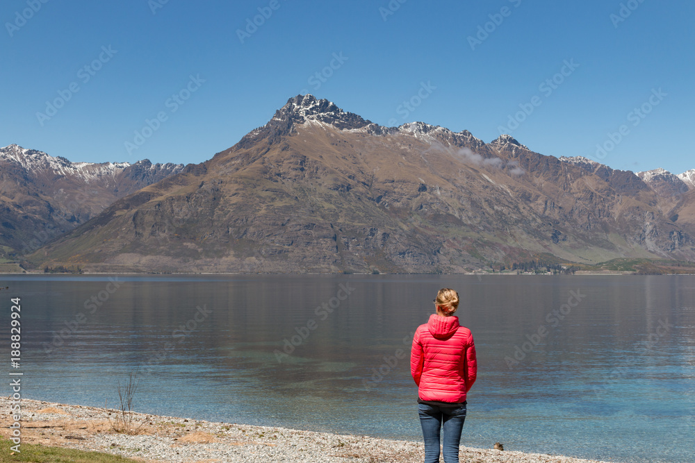 New Zealand Queenstown Lake Wakatipu blonde woman looking on the lake