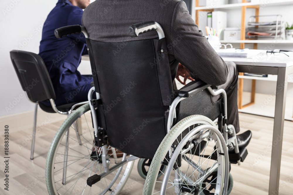 Businessman Sitting In Wheelchair Businessman Sitting In Wheelchair