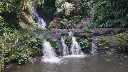 panning shot of elabana falls at lamington national park in queensland, australia photo