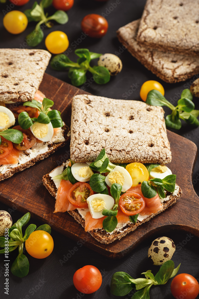 Smoked salmon sandwiches with tomatoes and eggs. Smoked salmon sandwiches with tomatoes and eggs.