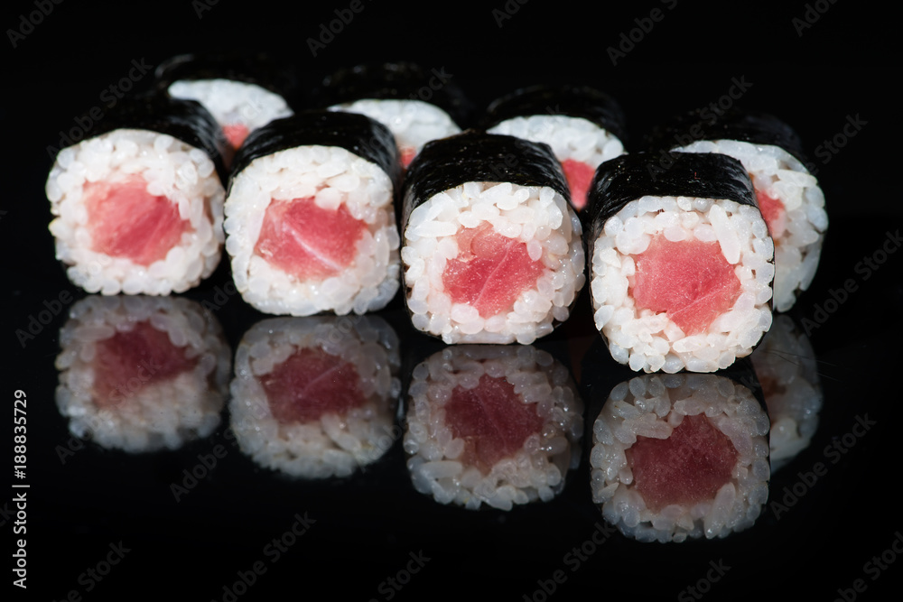 Fresh delicious Japanese sushi with meat on dark background Fresh delicious Japanese sushi with meat on dark background