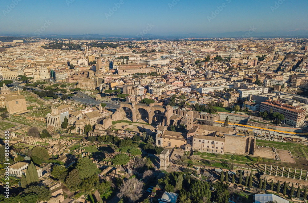 Cityscape of Rome. Aerial view of Colosseum and ancinet Roman ruins