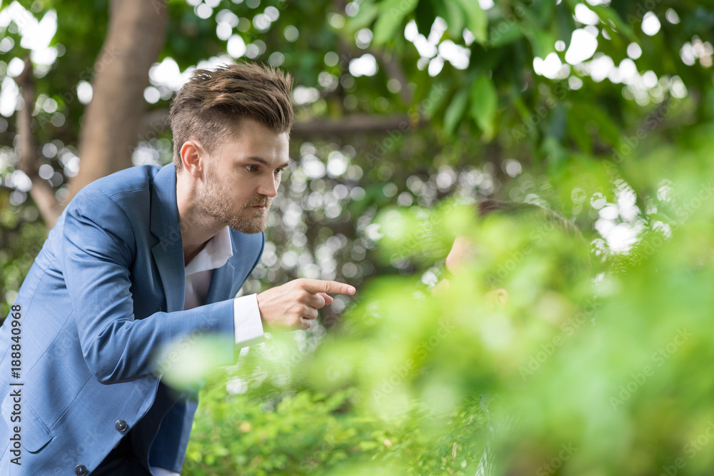 bearded business man pointing a finger to partner. bearded business man pointing a finger to partner.