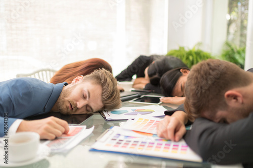 Tired business worker at conference in the office
