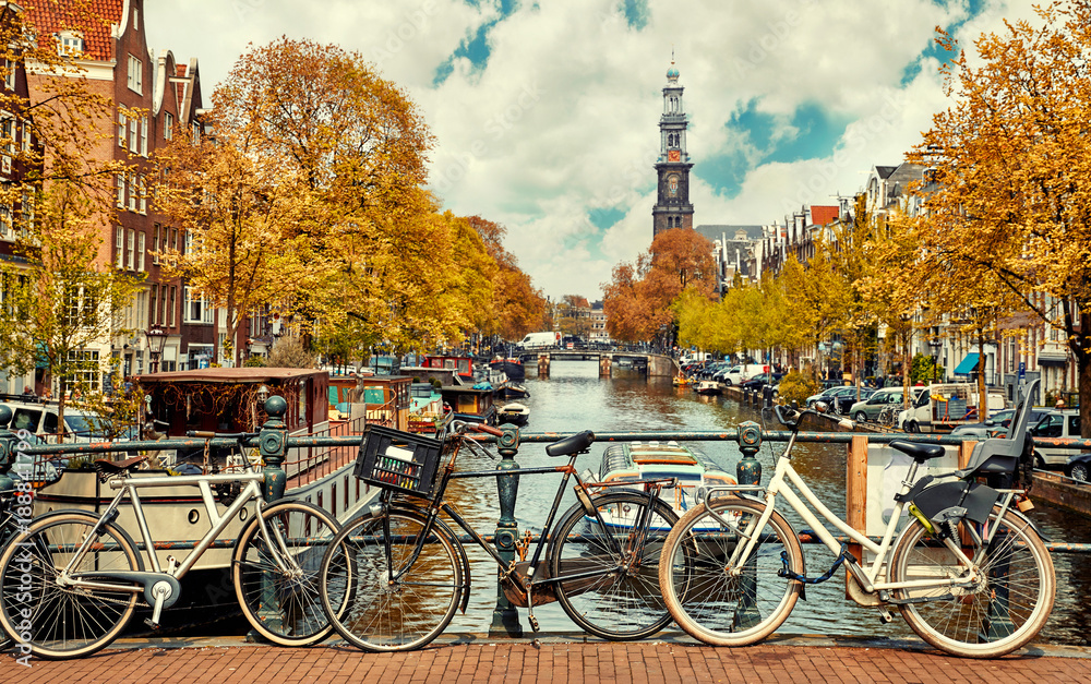 Bike over canal Amsterdam city. Picturesque town landscape