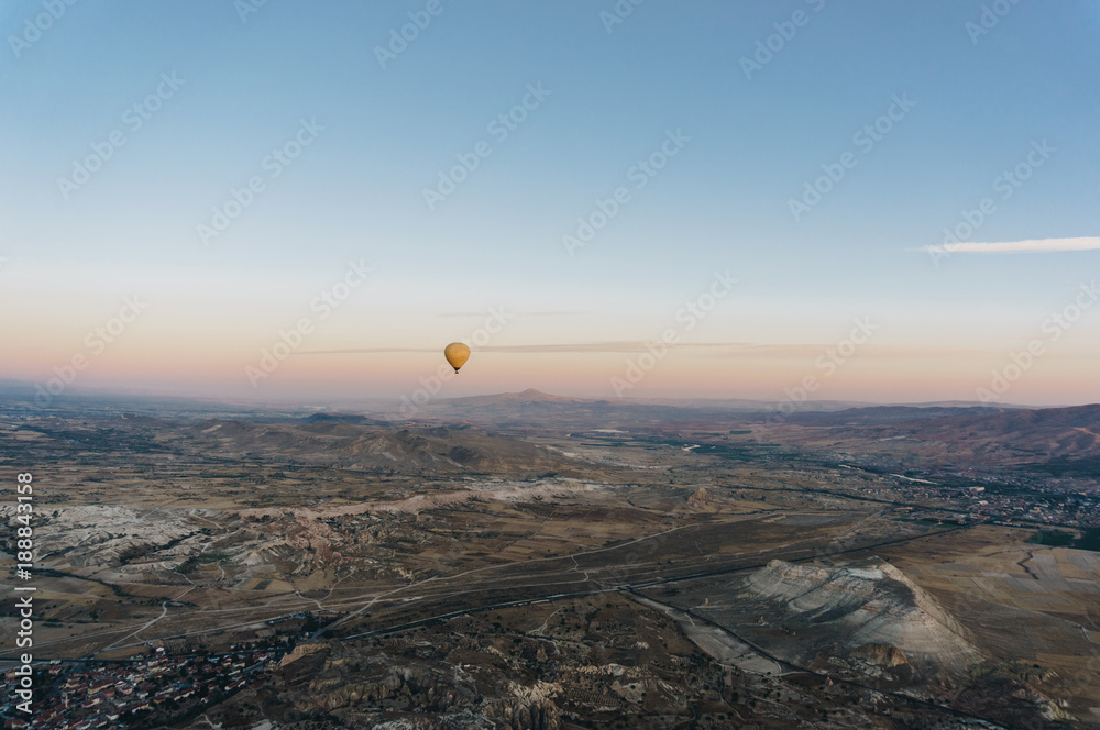 one hot air balloon flying Goreme national park, fairy chimneys, Cappadocia, Turkey one hot air balloon flying Goreme national park, fairy chimneys, Cappadocia, Turkey