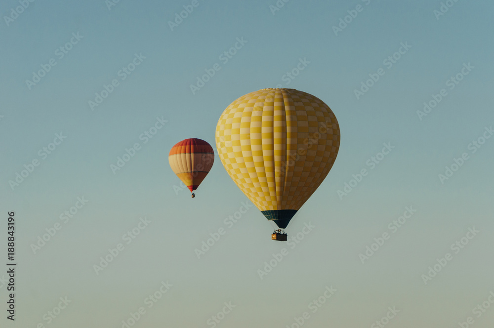Hot air balloons flying in blue sky Hot air balloons flying in blue sky