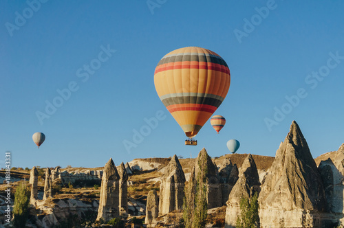 Hot air balloons flying in Goreme national park, fairy chimneys, Cappadocia, Turkey
