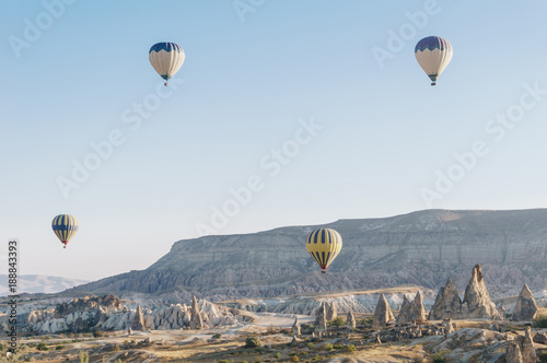 mountain landscape with Hot air balloons in Goreme national park, fairy chimneys, Cappadocia, Turkey