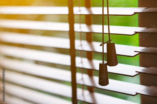 Wooden blinds with sun light.