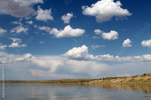 the sky reflected in the water, deserted beach lake, summer sky, nature, blue cloud, © lkurganskaya