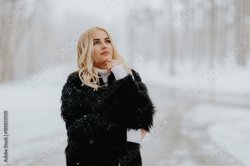 Pretty young blonde woman a...