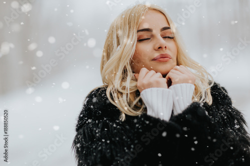 Pretty young blonde woman a...