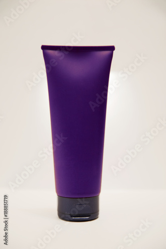 Violet tube with cream isolated over white