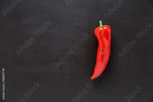 Fresh red sweet pepper on a black background