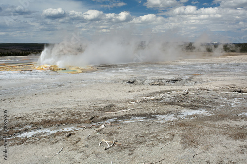 Gushing geyser on mineral plain
