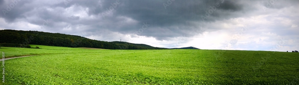 Obraz premium panorama of a brooding sky after a storm over a country field