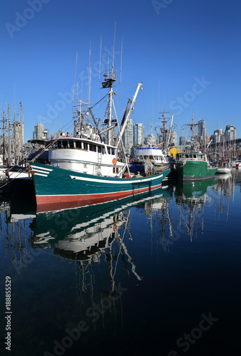 False Creek Fishermen's Wharf vertical. Fish boats at Vancouver’s Fishermen’s Wharf near Granville Island. British Columbia, Canada.