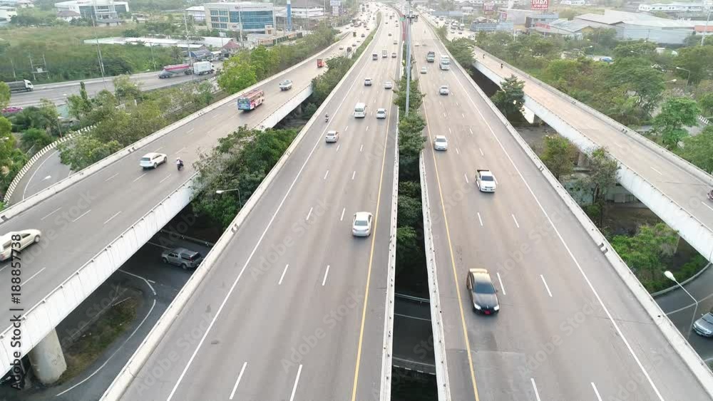 Of traffic on city streets at night. Expressway with car lots in the city in Thailand. beautiful Street .Aerial view and top view of traffic on freeway, 4K. Of traffic on city streets at night. Expressway with car lots in the city in Thailand. beautiful Street .Aerial view and top view of traffic on freeway, 4K.