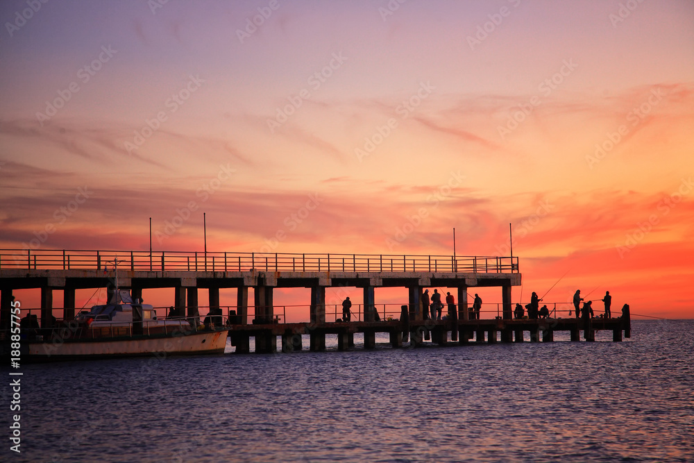 Fototapeta premium Fishing on a sunset