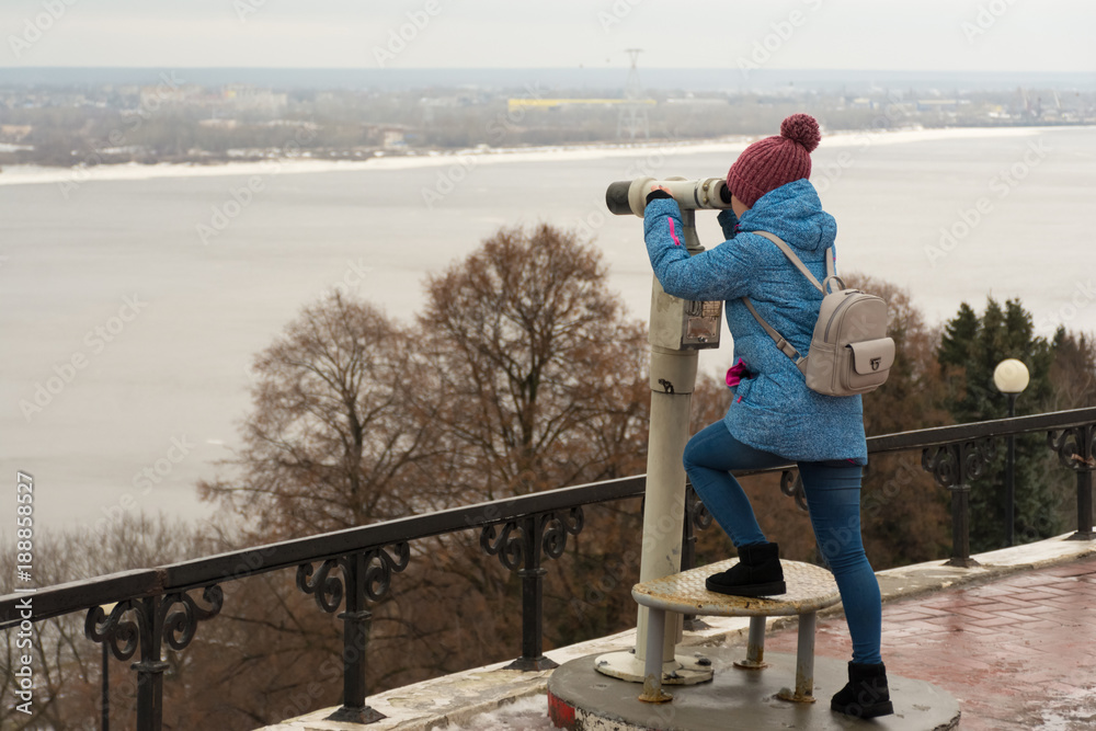girl looks into the stationary telescope girl looks into the stationary telescope