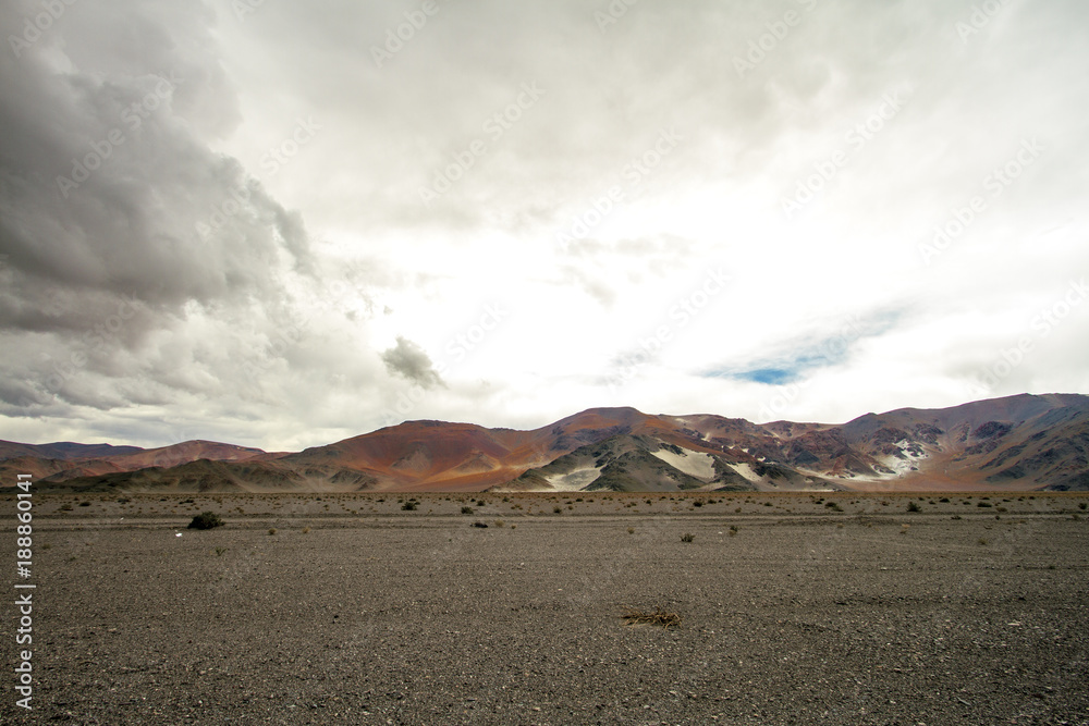 Colorful mountains with stormy background in the Andes in Catamarca, Argentina