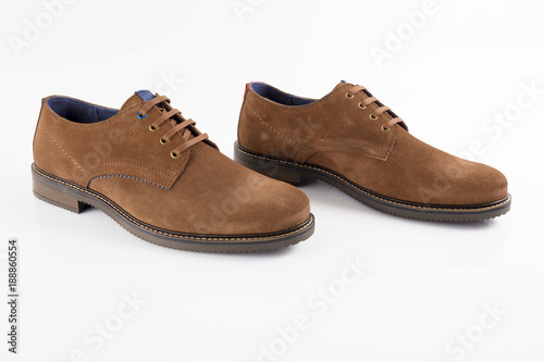 Male brown leather shoe on white background, isolated product, comfortable footwear.