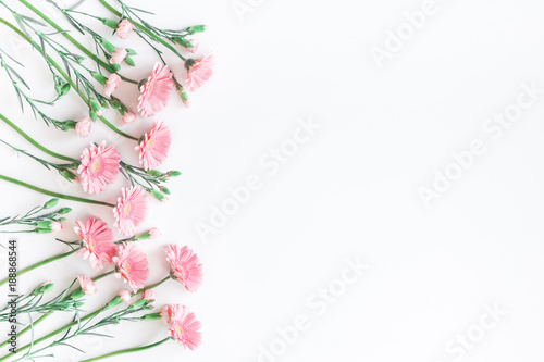 Flowers composition. Frame made of pink flowers on white background. Flat lay  top view  copy space