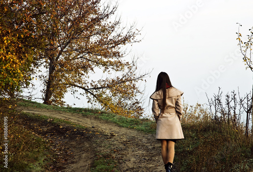 Girl walking along the road along the cliff © Pavlo