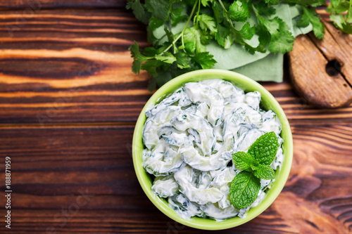 Indian cucumber raita with yoghurt, mint, cilantro. Greek tzatziki sauce