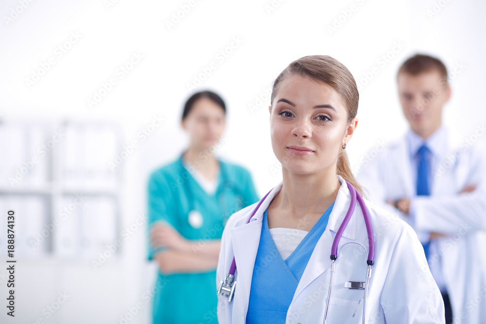Attractive female doctor in front of medical group. Attractive female doctor in front of medical group.