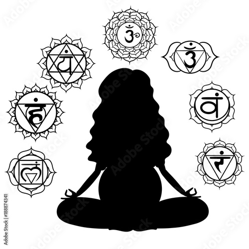 Silhouette of a pregnant woman meditating