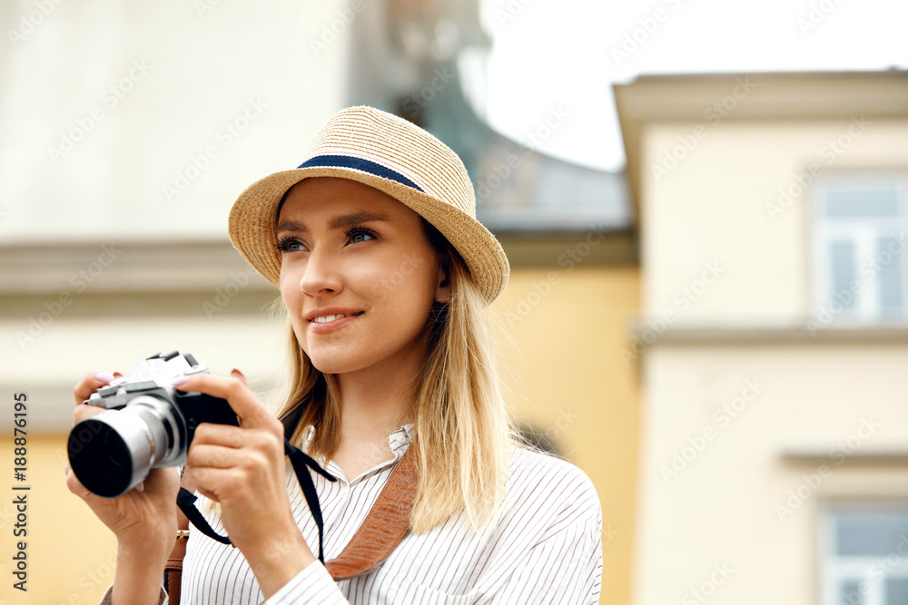 Tourist Girl With Camera Taking Photos On Street.