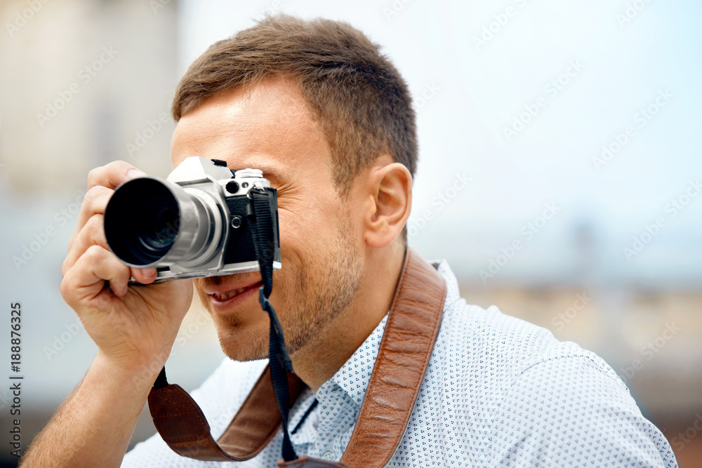 Tourist Man With Camera Taking Photos On Street.