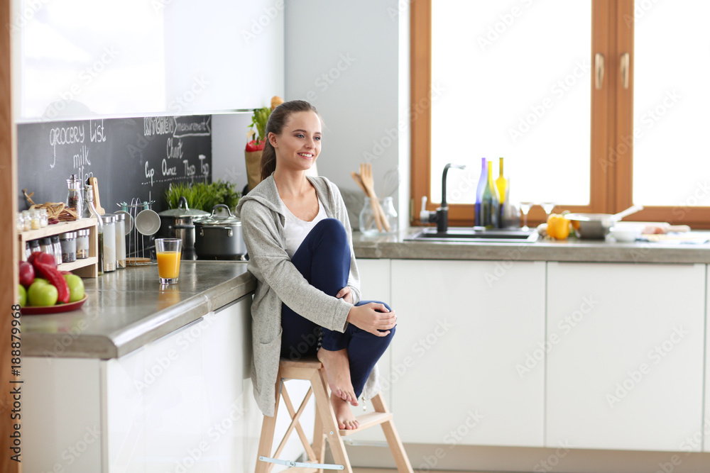 Woman in the kitchen. Cooking at kitchen. Woman in the kitchen. Cooking at kitchen.