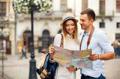 Couple With Map On Travel Vacations, Sightseeing