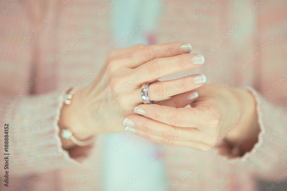 Wedding ring on woman's hand top