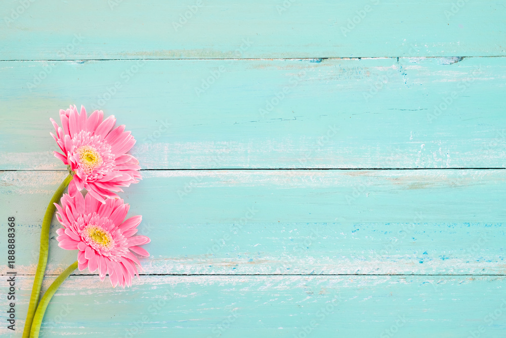 Pink flowers on vintage wooden in blue paint background, vintage pastel  color tone - concept flower of spring or summer background Stock Photo |  Adobe Stock