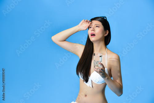 elegant young woman isolated on blue background