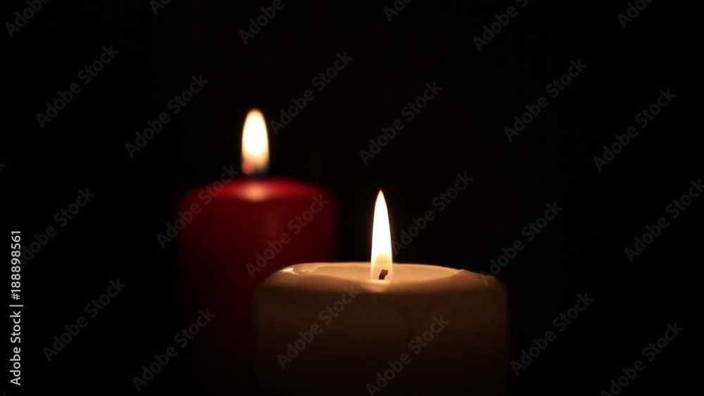 Candle burning close up on black background Candle burning close up on black background